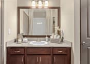 Thumbnail 12 of 31 - a bathroom with a sink and a mirror at The Ridge at Chenal Valley, Arkansas, 72223
