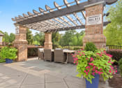 Thumbnail 17 of 31 - a patio with a table and chairs and a pergola at The Ridge at Chenal Valley, Little Rock