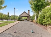 Thumbnail 19 of 31 - a pathway leading to a pavilion with balls on the ground at The Ridge at Chenal Valley, Little Rock, 72223
