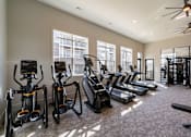 Thumbnail 25 of 43 - Gym with treadmills, elliptical machines, and stationary bikes at The One at Spartanburg, South Carolina, 29303