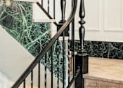 Thumbnail 23 of 25 - A staircase with a black railing and a green marble wall. at Parkview Apartments, Memphis, 38104