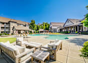 Thumbnail 17 of 38 - Poolside patio at The Ridge at Chenal Valley Apartments, Arkansas, 72223