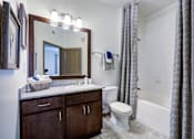 Thumbnail 9 of 38 - Bright Bathroom at The Ridge at Chenal Valley Apartments, Little Rock, AR, 72223