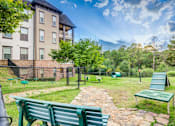 Thumbnail 24 of 38 - Benches in park at The Ridge at Chenal Valley Apartments, Little Rock, Arkansas