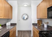 Thumbnail 14 of 38 - kitchen with wooden cabinets at The Shallowford Apartments, Chattanooga Tennessee