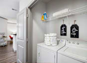 Thumbnail 19 of 38 - Laundry room with a washer and dryer at The Shallowford Apartments, Tennessee, 37421