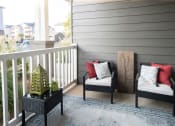 Thumbnail 13 of 27 - a porch with two chairs and a lantern on a balcony at The Shallowford, Chattanooga, 37421
