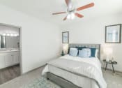 Thumbnail 6 of 27 - a bedroom with a bed and a ceiling fan at The Shallowford, Chattanooga, Tennessee