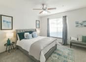Thumbnail 10 of 27 - a bedroom with a bed and a ceiling fan at The Shallowford, Chattanooga, Tennessee