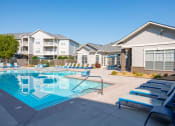 Thumbnail 14 of 27 - our apartments have a resort style pool with lounge chairs at The Shallowford, Chattanooga, TN, 37421