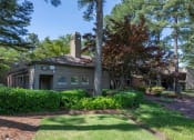 Thumbnail 20 of 29 - the front of a house with a lawn and trees at The Summit Apartments, Tennessee, 38128