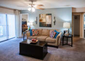 Thumbnail 4 of 29 - a living room with a couch and a coffee table at The Summit Apartments, Memphis, TN, 38128