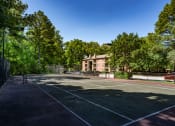 Thumbnail 15 of 29 - a tennis court with a building in the background at The Summit Apartments, Tennessee