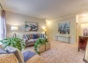 Thumbnail 9 of 30 - Living room with a couch at The Vineyards Apartments, Tennessee