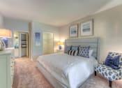 Thumbnail 11 of 30 - Bedroom with a large bed at The Vineyards Apartments, Germantown, TN