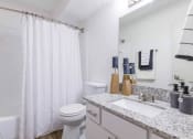 Thumbnail 9 of 14 - a bathroom with a shower and a sink and a toilet at The Waters at Chenal, Little Rock