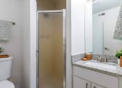 Thumbnail 8 of 14 - a bathroom with a shower and a sink and a toilet at The Waters at Chenal, Arkansas, 72211
