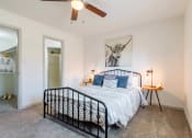 Thumbnail 7 of 14 - a bedroom with a bed and a ceiling fan at The Waters at Chenal, Little Rock, AR 72211