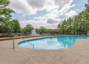 Thumbnail 12 of 14 - a swimming pool with trees and a fence around it at The Waters at Chenal, Little Rock, 72211