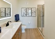 Thumbnail 3 of 29 - A sleek bathroom with a glass door shower