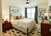 Thumbnail 8 of 29 - A bright and modern bedroom with warm natural colors