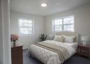 Thumbnail 5 of 19 - a bedroom with a bed and two windows  at Venue at Carrollton, Georgia