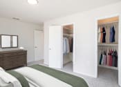 Thumbnail 7 of 19 - a bedroom with a closet and a bed and a dresser  at Venue at Carrollton, Georgia