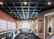 Thumbnail 18 of 22 - a pool table in a living room with a large window at The Villa at River Pointe, Maumelle, Arkansas