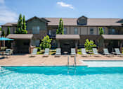 Thumbnail 10 of 26 - A large house with a pool in front. at Hall Creek Apartment Homes, Arlington, TN, 38002