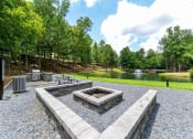 Thumbnail 25 of 33 - Gathering Area With Grills And Corn Hole at St. Andrews Apartment Homes, Johns Creek
