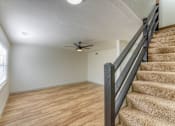 Thumbnail 9 of 24 - Living Room Stairs at The Garden District Apartments, Germantown, 38138  