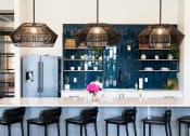 Thumbnail 18 of 25 - Clubhouse bar area and kitchen at Grand Island Apartments in Memphis TN 38103