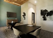 Thumbnail 7 of 8 - A conference room with a long table and chairs at Grays Creek Apartments, Tennessee 38018