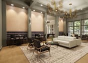 Thumbnail 5 of 8 - A modern living room with a white sofa and a wooden floor at Grays Creek Apartments, Tennessee