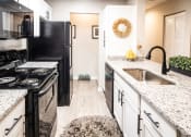 Thumbnail 3 of 36 - Modern Kitchen with Laundry Room at Grove Point, Norcross, 30093