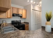 Thumbnail 1 of 22 - Granite Counter Tops In Kitchen at Hampton Woods, Kansas