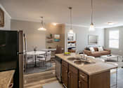 Thumbnail 4 of 18 - Kitchen with Stainless Steel Appliances and cabinets1 at Harbor Island Apartments, Memphis, TN, 38103