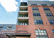 Thumbnail 36 of 37 - A red brick building with the words at Harbor Side at Conwood Flats Apartments in Uptown Memphis, TN