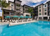 Thumbnail 9 of 18 - Swimming Pool With Relaxing Sundecks at Harrison Apartments, Florida