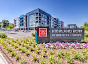Thumbnail 14 of 14 - A sign for Highland Row Residences and Shops is in front of a building at Highland Row Apartments, Memphis, TN,  38111