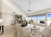 Thumbnail 18 of 38 - A living room with a large window overlooking the beach.at Iris Luxury Apartments, Memphis, TN 38105  