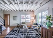 Thumbnail 10 of 28 - A living room with a black and white checkered rug at Kiwi Goji Apartments, Tennessee