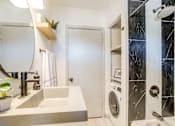 Thumbnail 28 of 28 - a bathroom sink that is modern and gray in color at Kiwi Goji Apartments, Tennessee