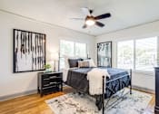 Thumbnail 17 of 28 - a bedroom with wood floors at Kiwi Goji Apartments, Memphis