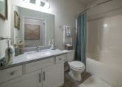 Thumbnail 8 of 28 - a bathroom with a sink toilet and a shower