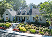 Thumbnail 29 of 29 - A white house with a black roof and a garden in front. at Manchester at Mansell, Georgia ,30076