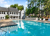 Thumbnail 1 of 29 - A large swimming pool in front of a house. at Manchester at Mansell, Roswell, GA 30076 
