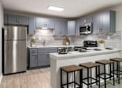 Thumbnail 2 of 29 - A kitchen with a stainless steel refrigerator, wooden bar stools, and a white countertop. at Manchester at Mansell, Roswell, GA