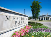 Thumbnail 29 of 29 - a sign that says meridian park with flowers in front of it,  at Meridian Park Apartments, Collierville, Tennessee