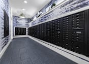 Thumbnail 23 of 25 - A long hallway with a wall of lockers on one side.